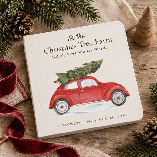 A baby's first winter words board book titled 'At the Christmas Tree Farm' by A Flowers & Folk Collection, featuring an illustration of a red car carrying a Christmas tree. The book is styled on a rustic wooden surface with pine branches, a red velvet ribbon, and a small wooden tree ornament.
