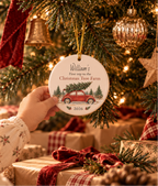 Personalized Christmas tree farm ornament hanging above wrapped Christmas gifts